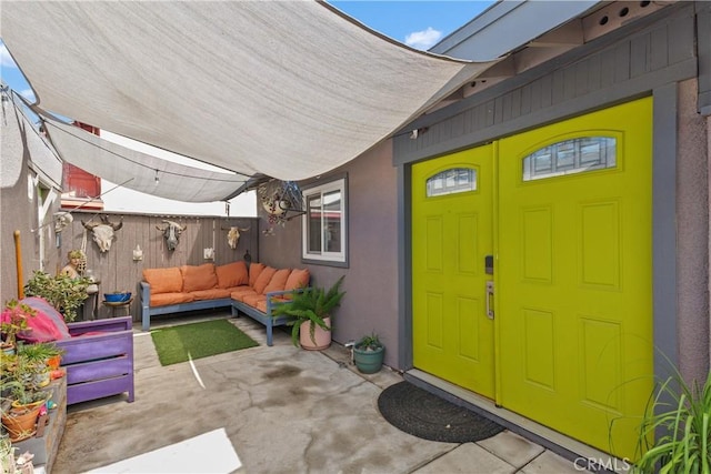 5080 Pearblossom, Riverside, CA 92507 - entrance to property featuring outdoor lounge area, a patio area, and stucco siding