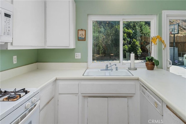 5080 Pearblossom, Riverside, CA 92507 - kitchen featuring white appliances, light countertops, and white cabinetry