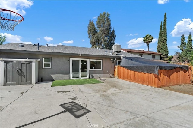 5080 Pearblossom, Riverside, CA 92507 - back of property with stucco siding, a patio area, and roof with shingles