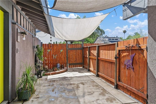 5080 Pearblossom, Riverside, CA 92507 - view of patio / terrace featuring a gate
