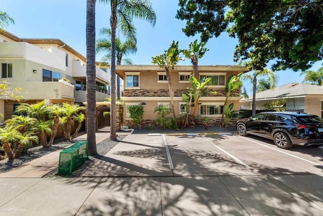 1361 Felspar St Unit 7, San Diego, CA 92109 - multi unit property with stucco siding, uncovered parking, and stone siding