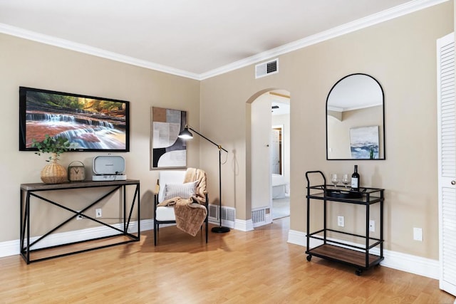 1361 Felspar St Unit 7, San Diego, CA 92109 - sitting room featuring arched walkways, wood finished floors, and crown molding