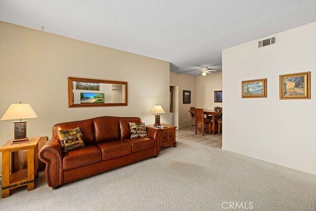 2823 W W Ave K12, Unit 136, Lancaster, CA 93536 - living room featuring carpet flooring and a ceiling fan
