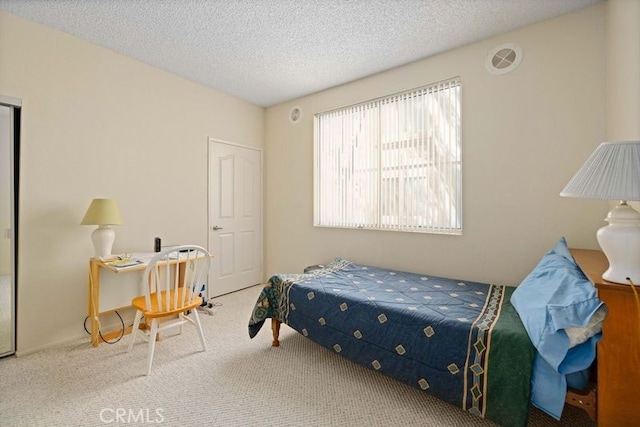 2823 W W Ave K12, Unit 136, Lancaster, CA 93536 - bedroom featuring carpet and a textured ceiling