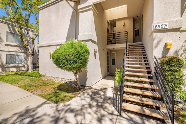 2823 W W Ave K12, Unit 136, Lancaster, CA 93536 - doorway to property featuring stucco siding