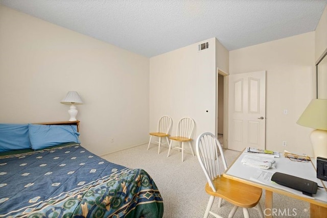 2823 W W Ave K12, Unit 136, Lancaster, CA 93536 - bedroom featuring carpet, an office area, and a textured ceiling