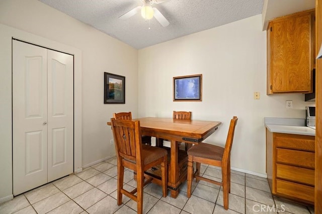 2823 W W Ave K12, Unit 136, Lancaster, CA 93536 - dining area with ceiling fan, light tile patterned flooring, and a textured ceiling