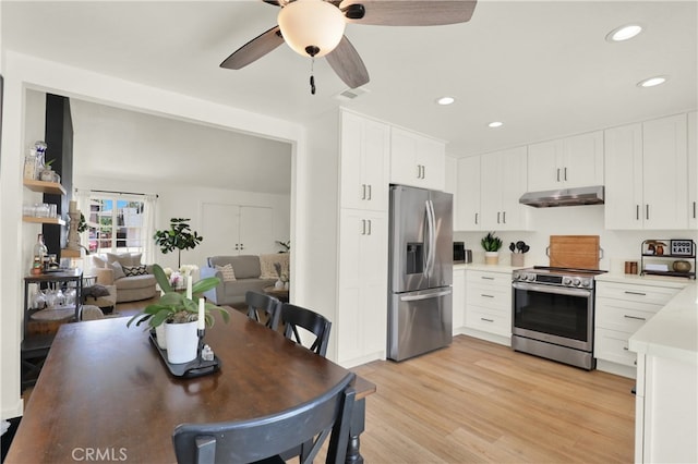 27322 Eastridge Dr, Lake Forest, CA 92630 - kitchen with appliances with stainless steel finishes, under cabinet range hood, light countertops, a ceiling fan, and light wood-style floors