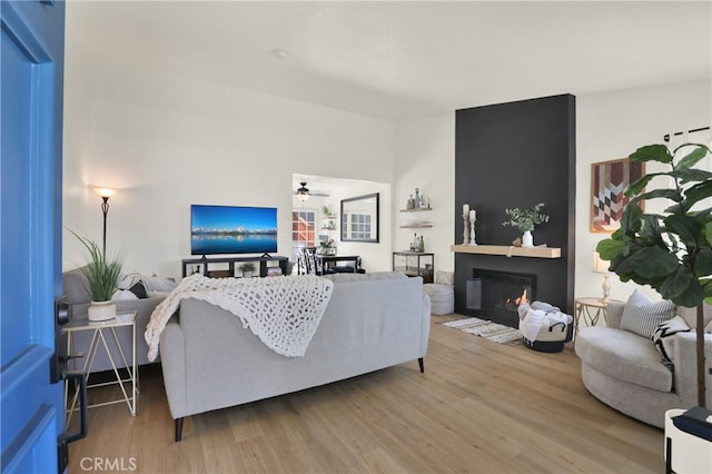 27322 Eastridge Dr, Lake Forest, CA 92630 - living area featuring wood finished floors, a glass covered fireplace, and ceiling fan