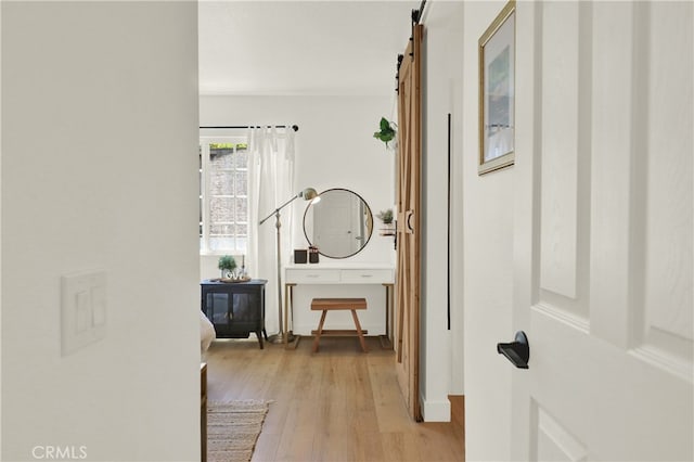 27322 Eastridge Dr, Lake Forest, CA 92630 - hallway featuring light wood-type flooring and a barn door