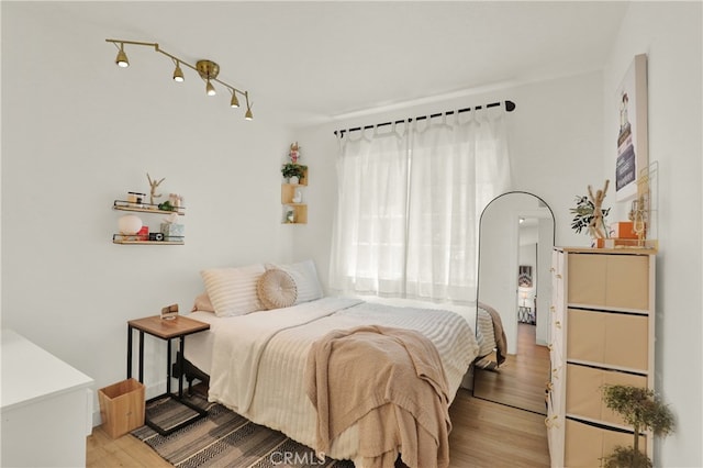 27322 Eastridge Dr, Lake Forest, CA 92630 - bedroom featuring light wood finished floors and arched walkways