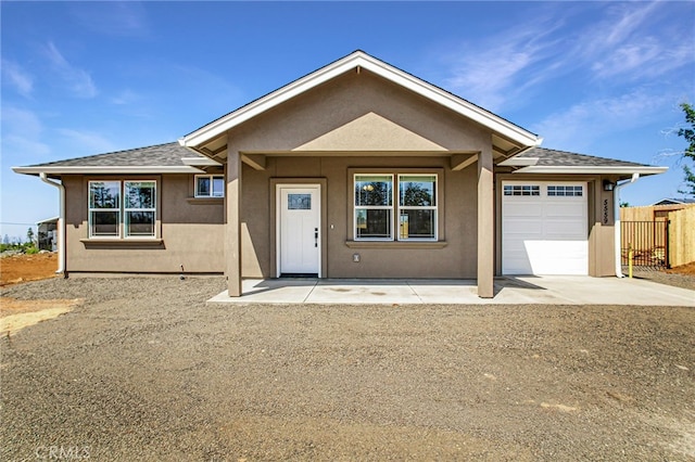 836 Regnier Ln, Paradise, CA 95969 - ranch-style home featuring a garage, stucco siding, concrete driveway, and roof with shingles