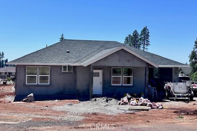 836 Regnier Ln, Paradise, CA 95969 - view of front of home with stucco siding and a shingled roof
