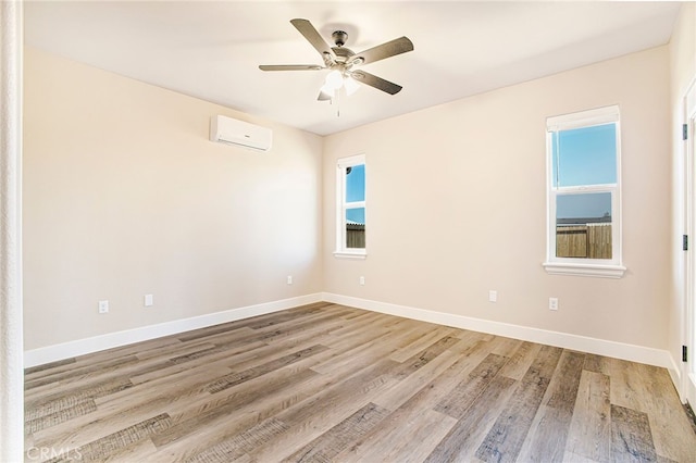 836 Regnier Ln, Paradise, CA 95969 - spare room featuring a wall mounted air conditioner, light wood-type flooring, and ceiling fan