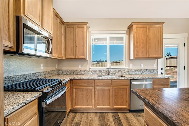 836 Regnier Ln, Paradise, CA 95969 - kitchen featuring stainless steel appliances, wood finished floors, and light stone counters