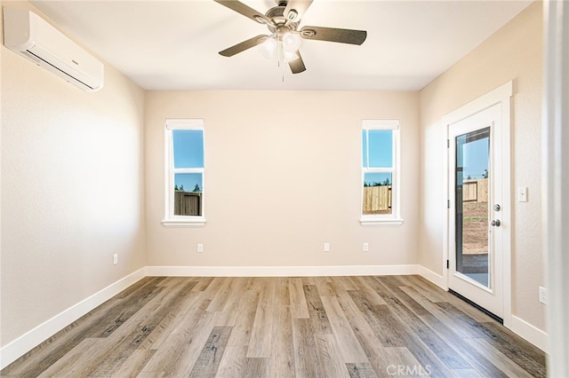 836 Regnier Ln, Paradise, CA 95969 - spare room with a wall mounted air conditioner, light wood-style floors, and a ceiling fan