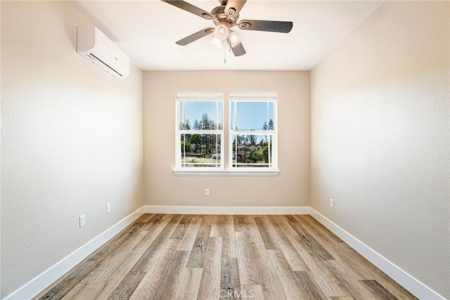 836 Regnier Ln, Paradise, CA 95969 - spare room with a wall mounted AC, light wood finished floors, and ceiling fan