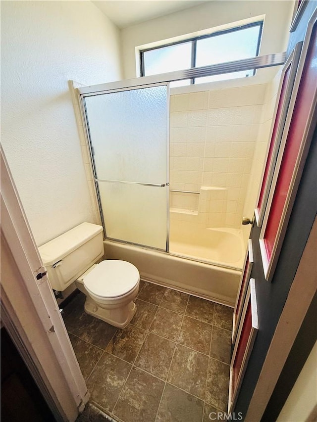 4043 Utah St Unit 8, San Diego, CA 92104 - bathroom featuring toilet and bath / shower combo with glass door