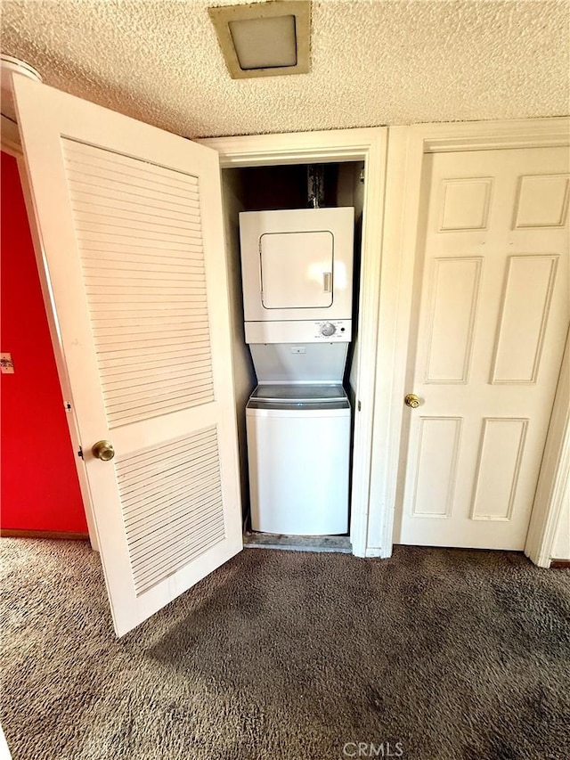 4043 Utah St Unit 8, San Diego, CA 92104 - laundry area with carpet, stacked washer / dryer, and a textured ceiling