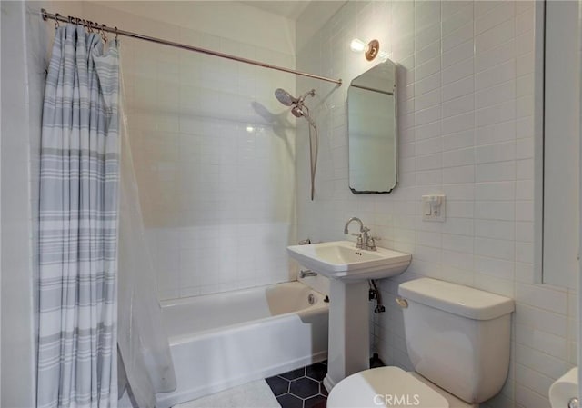 571 W 17th St, San Pedro, CA 90731 - bathroom with tile walls, shower / bath combination with curtain, tasteful backsplash, and tile patterned flooring