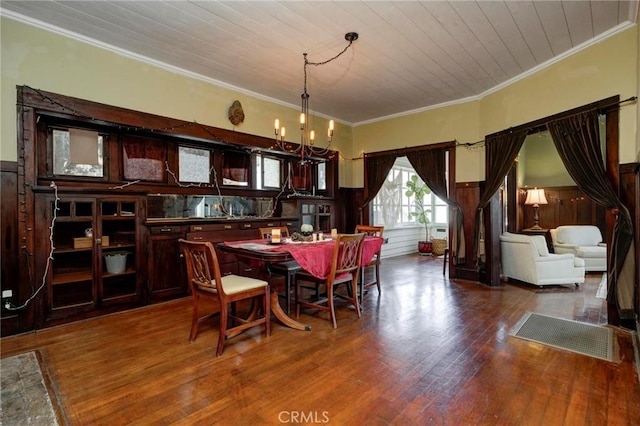 571 W 17th St, San Pedro, CA 90731 - dining room with a chandelier, ornamental molding, wood finished floors, a wainscoted wall, and wooden ceiling