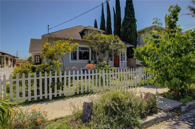 571 W 17th St, San Pedro, CA 90731 - view of property hidden behind natural elements featuring a fenced front yard