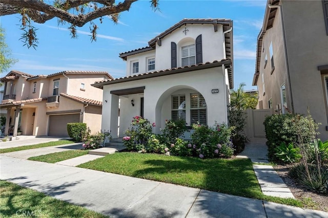 49 Eaglecreek, Irvine, CA 92618 - mediterranean / spanish house with stucco siding, driveway, a porch, a front lawn, and a tiled roof