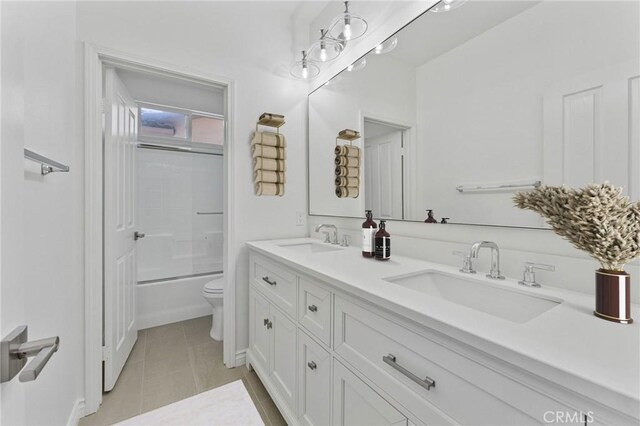 49 Eaglecreek, Irvine, CA 92618 - bathroom with double vanity, tile patterned flooring, and bath / shower combo with glass door
