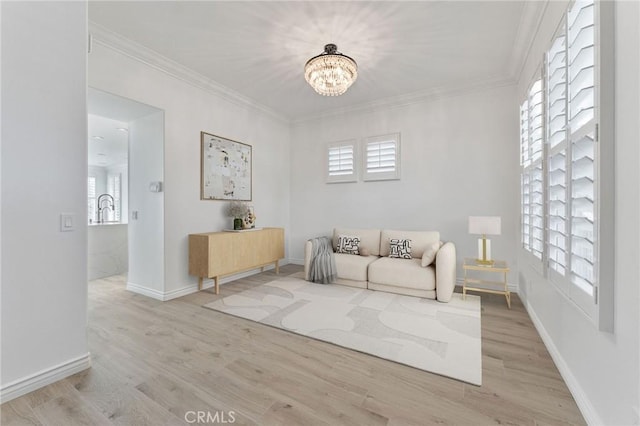 49 Eaglecreek, Irvine, CA 92618 - living area with a chandelier, light wood-type flooring, plenty of natural light, and crown molding