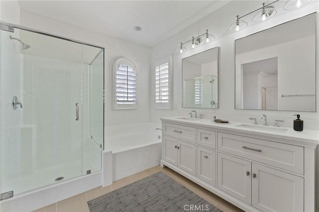 49 Eaglecreek, Irvine, CA 92618 - full bath featuring a stall shower, a garden tub, double vanity, and tile patterned flooring