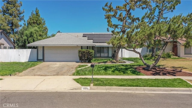 3966 Laurel Ct, Chino Hills, CA 91709 - ranch-style house with an attached garage, roof mounted solar panels, concrete driveway, and roof with shingles