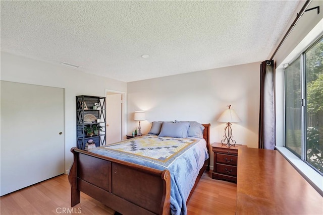 3966 Laurel Ct, Chino Hills, CA 91709 - bedroom with light wood-style flooring and a textured ceiling