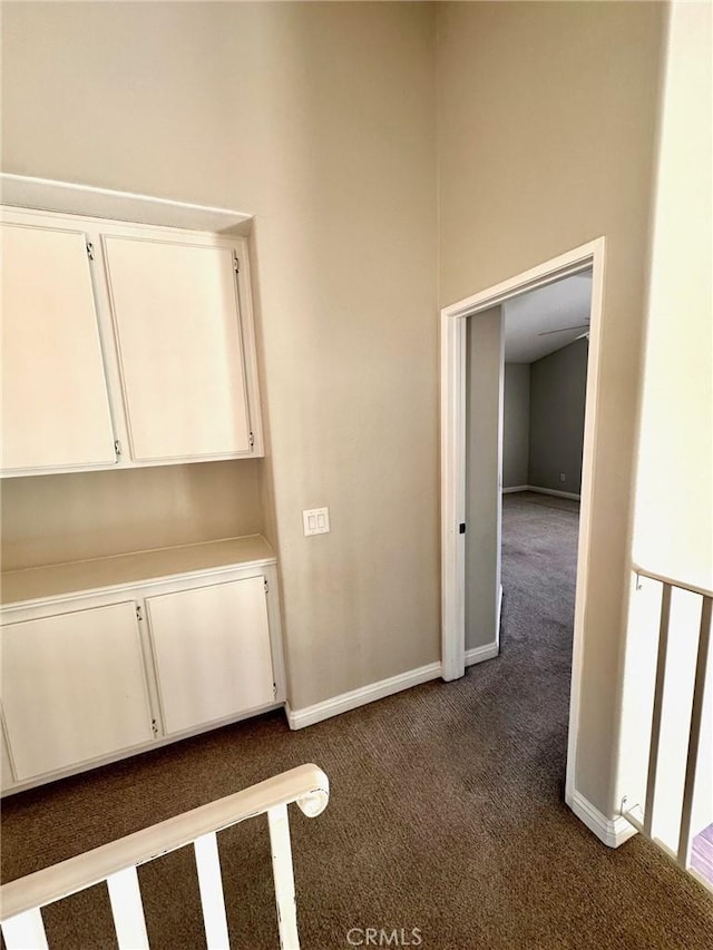 13067 Winterpark Way, Riverside, CA 92503 - hall featuring dark colored carpet and baseboards