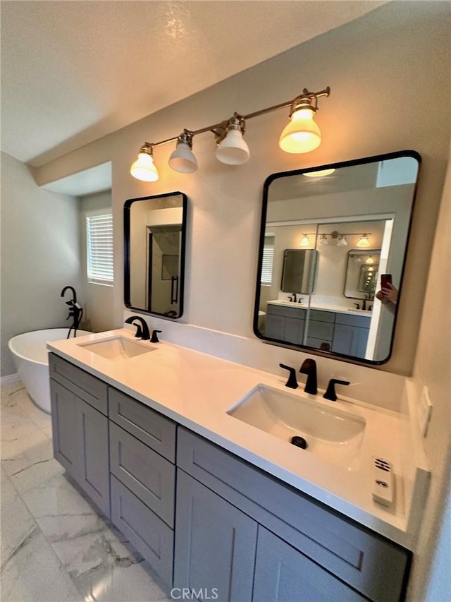 13067 Winterpark Way, Riverside, CA 92503 - bathroom featuring double vanity, marble finish flooring, and a soaking tub