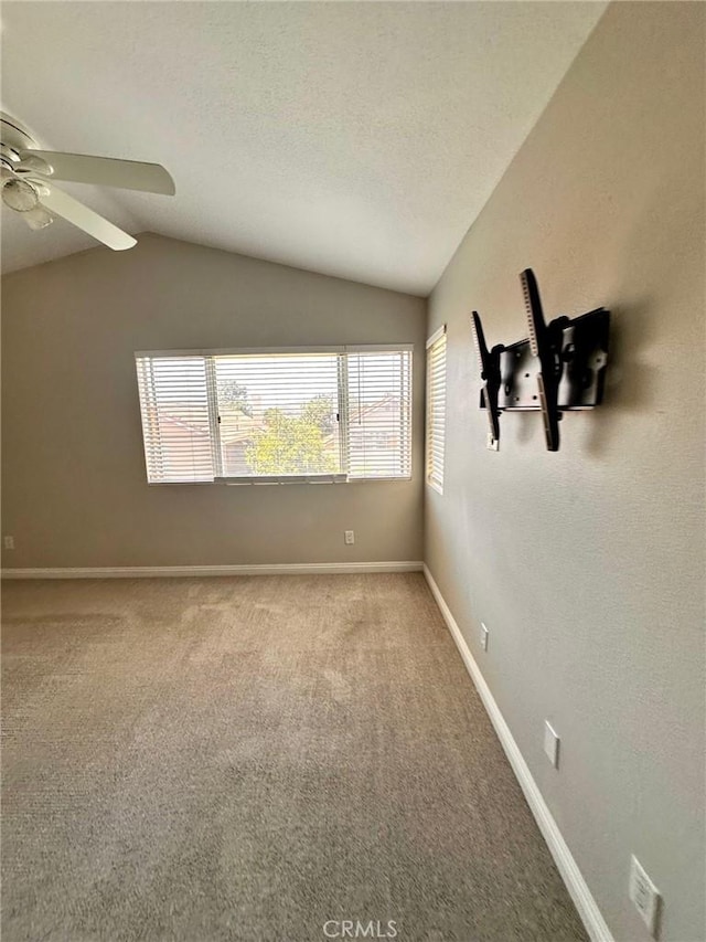 13067 Winterpark Way, Riverside, CA 92503 - carpeted empty room with vaulted ceiling, ceiling fan, and a textured ceiling