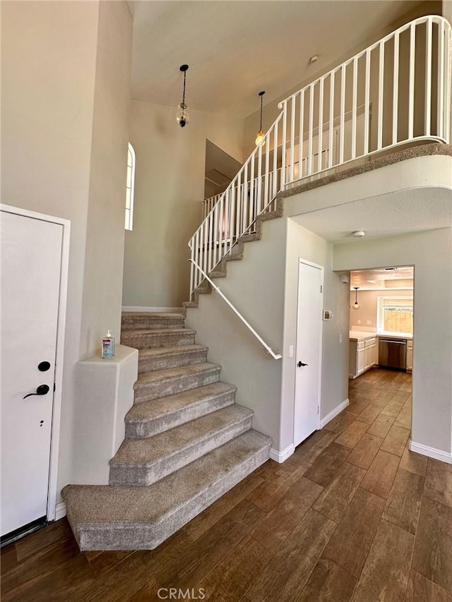 13067 Winterpark Way, Riverside, CA 92503 - staircase with wood finished floors and a towering ceiling