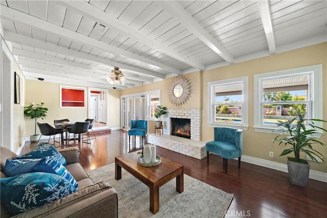9662 Crosby Ave, Garden Grove, CA 92844 - living area featuring wood finished floors, a brick fireplace, a wooden ceiling with exposed beams, and a ceiling fan