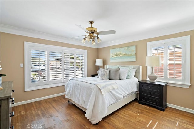 9662 Crosby Ave, Garden Grove, CA 92844 - bedroom featuring multiple windows, crown molding, wood finished floors, and ceiling fan