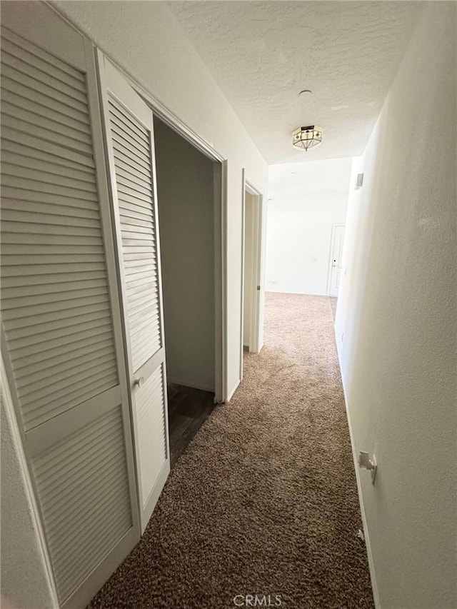 32161 Zircon Rd, Lucerne Valley, CA 92356 - hall featuring carpet floors and a textured ceiling