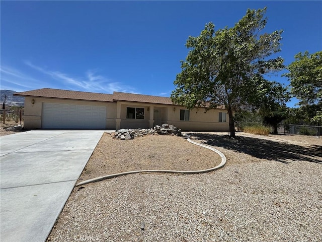 32161 Zircon Rd, Lucerne Valley, CA 92356 - ranch-style home featuring driveway, a garage, and stucco siding