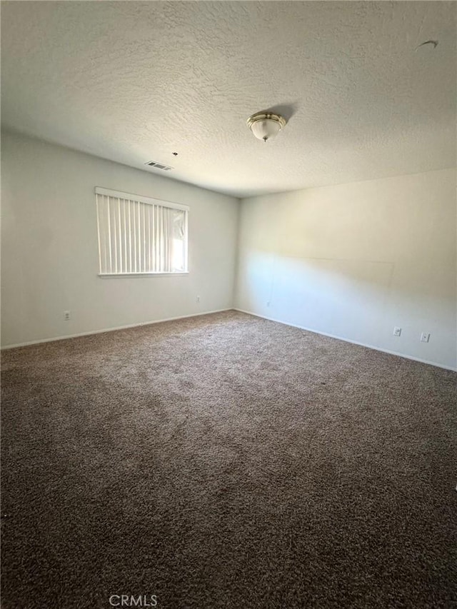 32161 Zircon Rd, Lucerne Valley, CA 92356 - carpeted empty room featuring a textured ceiling and baseboards