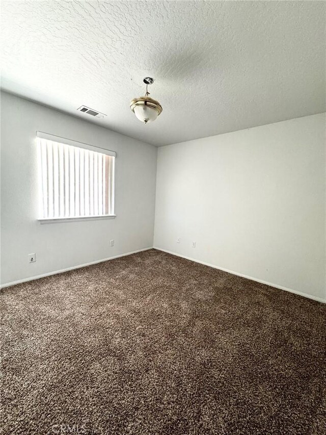 32161 Zircon Rd, Lucerne Valley, CA 92356 - carpeted empty room featuring a textured ceiling and baseboards
