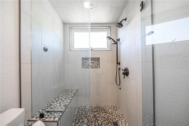 1440 Amanda Pl, Upland, CA 91784 - bathroom featuring toilet and a tile shower