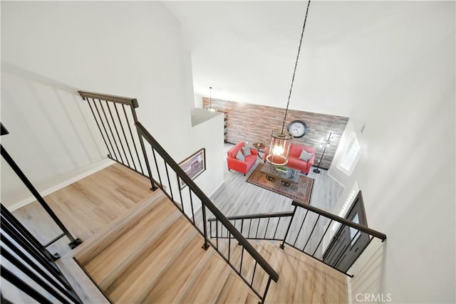 1440 Amanda Pl, Upland, CA 91784 - staircase with wood finished floors and a high ceiling