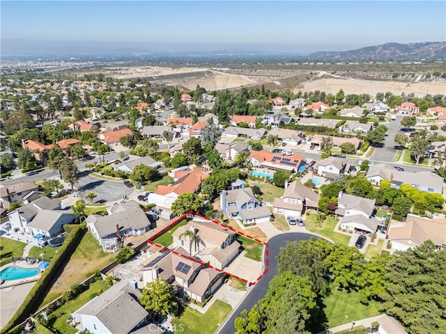 1440 Amanda Pl, Upland, CA 91784 - aerial view of property and surrounding area with property parcel outlined, nearby suburban area, and a mountainous background