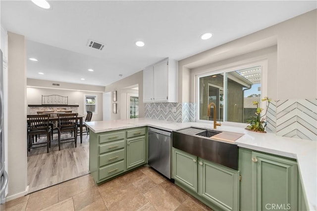 1440 Amanda Pl, Upland, CA 91784 - kitchen with green cabinetry, stainless steel dishwasher, plenty of natural light, light countertops, and recessed lighting