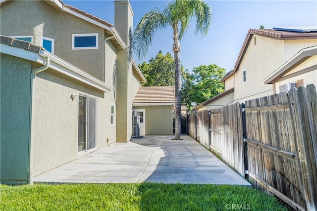 1440 Amanda Pl, Upland, CA 91784 - exterior space with stucco siding, a chimney, a patio, and a tile roof