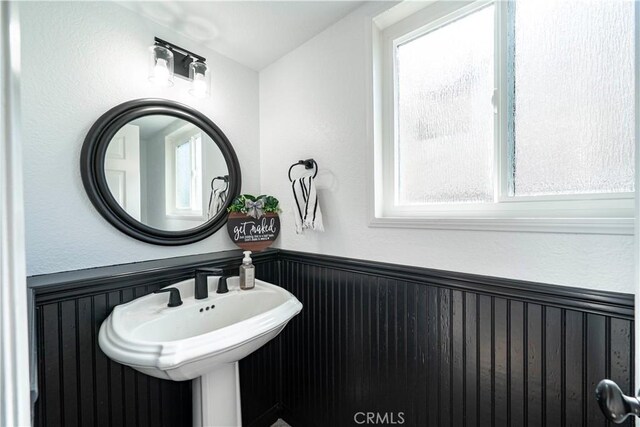 1440 Amanda Pl, Upland, CA 91784 - bathroom featuring wainscoting and plenty of natural light