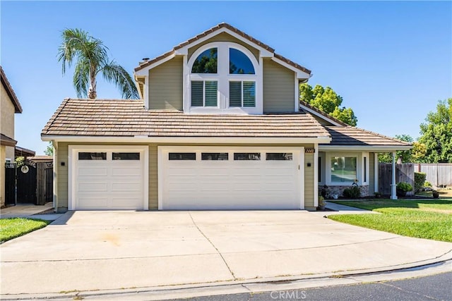 1440 Amanda Pl, Upland, CA 91784 - traditional-style house with driveway, a tiled roof, and a garage