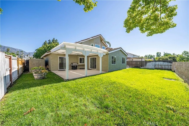1440 Amanda Pl, Upland, CA 91784 - back of property with a pergola, stucco siding, a patio, and a fenced backyard